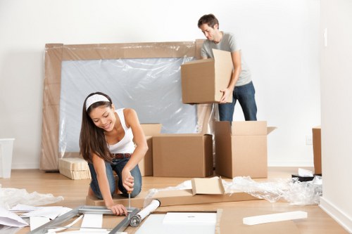 Packed boxes and suitcases prepared for student storage in West Hampstead