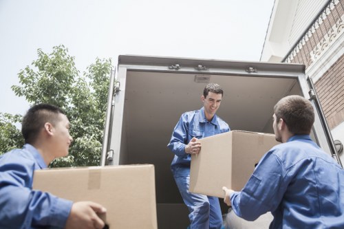 Furniture and boxes being unloaded at a Westhampstead property