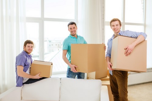 Boxes and furniture being prepared for storage in a West Hampstead property